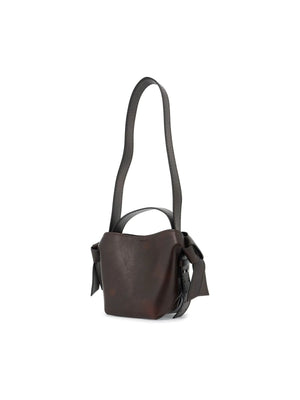 Dark brown leather Musubi Mini Bag with long shoulder strap and side ties