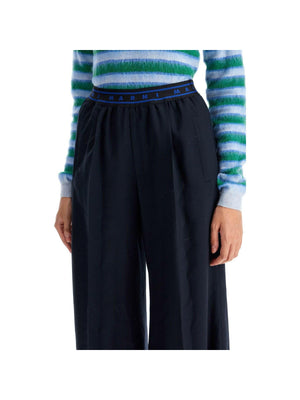 Flared Wool Trousers.