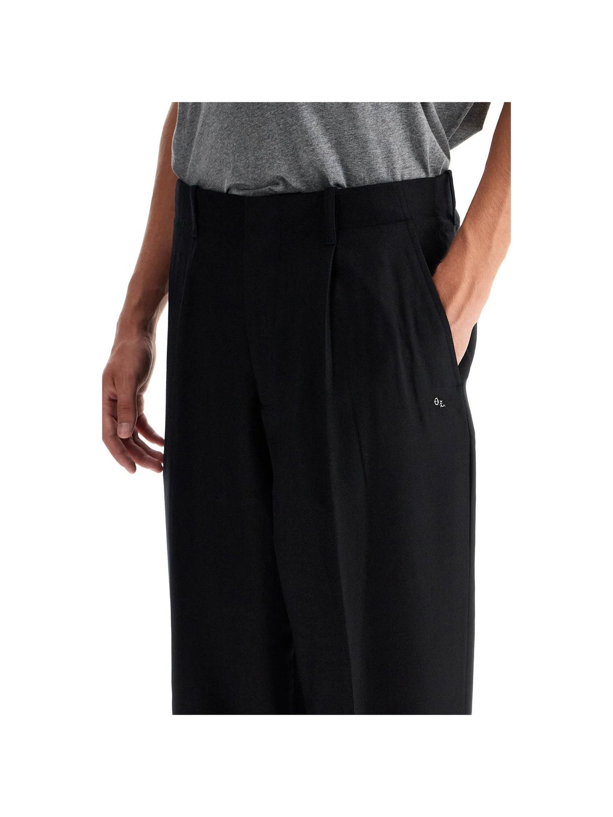 Black Panama Wool Tailored Trousers with a hand in the pocket for a stylish look